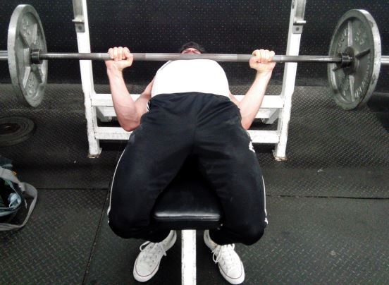 squeeze bench between thighs to increase leg drive