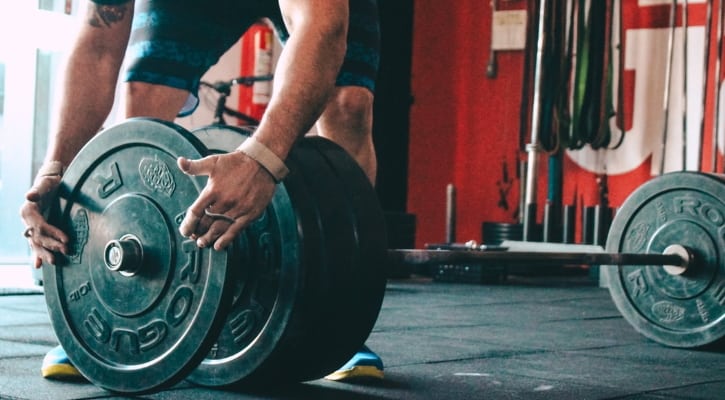 Adding Weight to the Bar to Achieve Progressive Overload